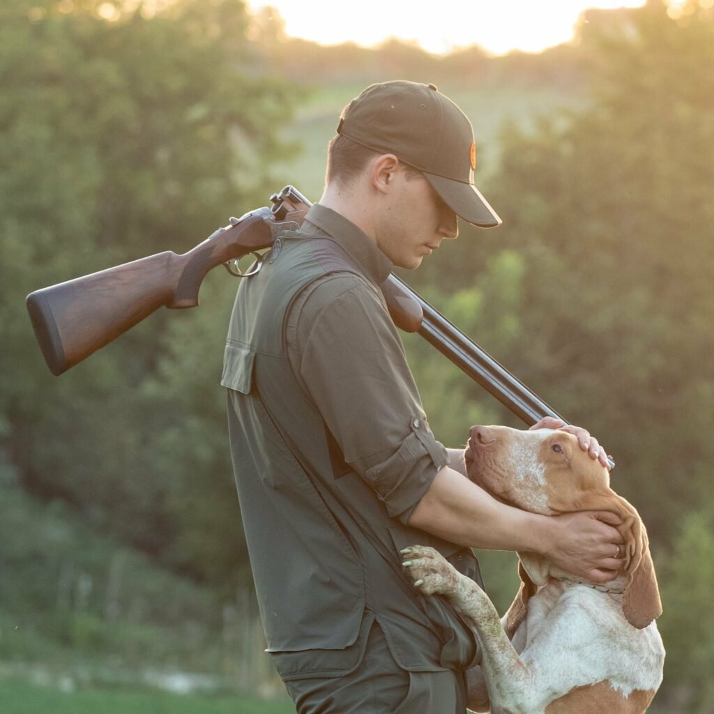 a hunter with a dog out upland hunting